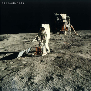 Apollo 11 astronaut assembling seismic experiment