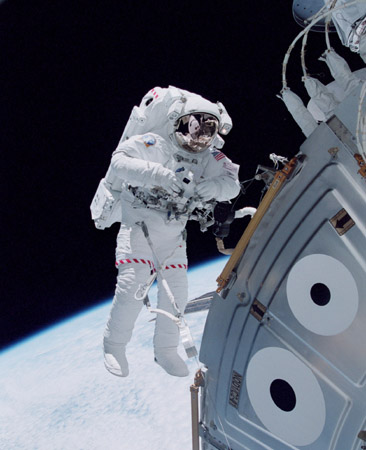 Space shuttle astronaut Michael Lopez-Alegria floating in space outside the Unity module of the International Space Station in October 2000, during an early stage of the station's assembly in Earth orbit. Credit: NASA