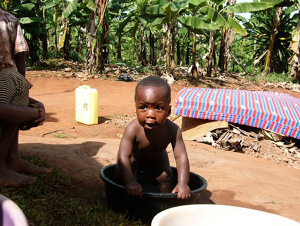 Daniel's youngest, a son. Daniel has the only water spigot in his part of the village. By Maylea.