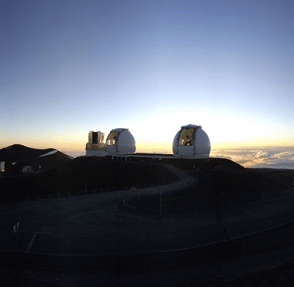 Keck domes. View of the summit at dusk, with the telescope doors open to equalise temperature inside and outside of the domes.